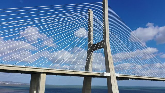 Famous Vasco da Gama Bridge over River Tejo in Lisbon from above - aerial drone footage