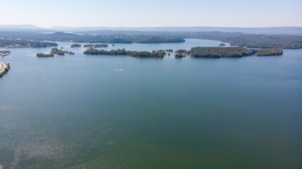 Aerial view of blue lakes and green forests on a sunny summer day in Finland. drone photography