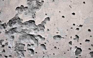 Bullet marks on an old wall, concept of wars and military confilcts in the 21st century.