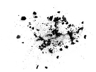 Black charcoal texture background. Black wood charcoal dust isolated on white background. Coal dust and wood charcoal.