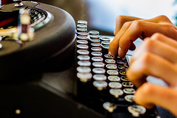 Hands on a typewriter 