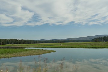 YellowYellowstone River with the clouds reflected in the waters at the Yellowstone National Park.stone River views