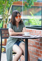 woman sitting in a cafe terrace