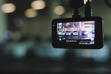 video camera recorder inside vehicle in car park
