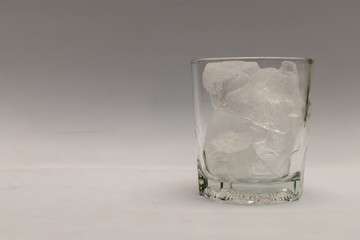 A close up in a glass of ice on white background, Isolated background
