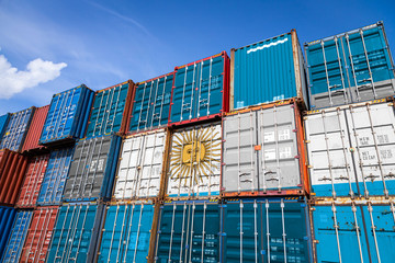 The national flag of Argentina on a large number of metal containers for storing goods stacked in...