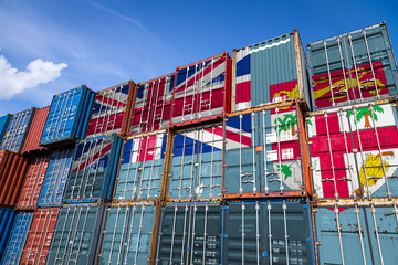 The national flag of Fiji on a large number of metal containers for storing goods stacked in rows...