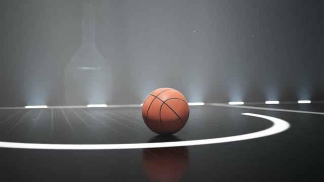 Close-up view at a ball on the basketball court. Nightly scenery. Lighting. 4KHD