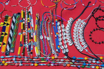 Tribal masai colorful bracelets for sale for tourists at the beach market, close up. Island of Zanzibar, Tanzania, Africa