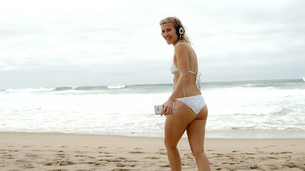 Fototapeta na wymiar Sexy girl wearing a bikini at the beach - summer vacation at the ocean - travel photography