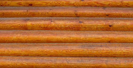 rough wooden timber background , brown and orange log wall texture , beam walls close up for building design