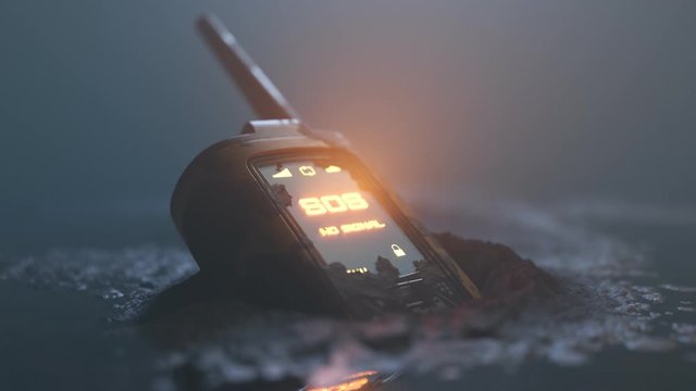 Close up of walkie-talkie left on the ground showing flashing SOS signal. 4K HD