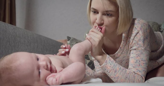 Mother communicates with her little baby girl.