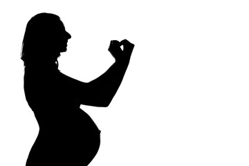 silhouette of a pregnant woman on a white background. The expectant mother shows the heart sign with her hands. The concept of a healthy lifestyle, IVF, expression of emotions, gestures. Copy space