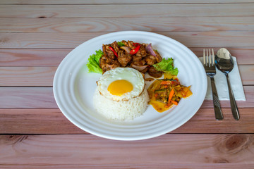 Asian Chinese food, Stirred fry spicy sliced chicken with sunny side up egg pickled vegetables