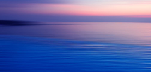 Naklejka na ściany i meble Blurred background of refraction in water