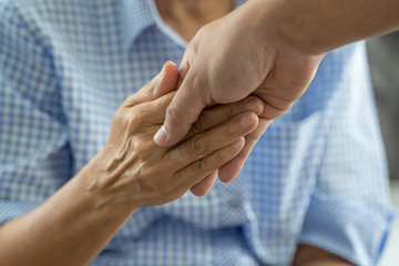 people old woman  and young hand holding Disabled walking with assistance