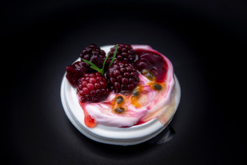 Dessert Pavlova of meringue with blackberries