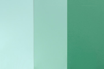 Yelllow green blue color paper background. Geometric flat composition. Empty space on monochrome cardboard.