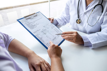 Doctor and patient are discussing consultation about symptom problem diagnosis of disease talk to the patient about medication and treatment method