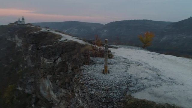 flying around with drone a medieval stone cross and raut river in orheiul vechi, butuceni, moldova