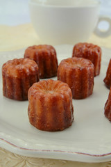 several cannelés on a plate	