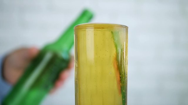 Full Glass with Cold and Fresh Beer in Front of a Thirsty Person