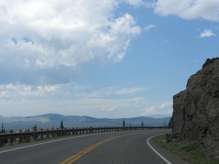 Sharp turn on the road with breathtaking views at Yellowstone National Park in Wyoming.
