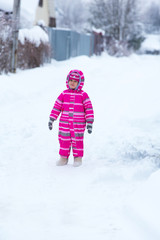 Fototapeta na wymiar Girl playing outside in winter