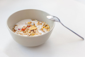 Muesli with yogurt in a bowl. Healthy breakfast concept.