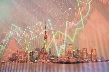 Forex chart on cityscape with tall buildings background multi exposure. Financial research concept.