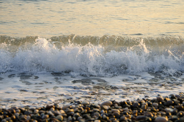 Beautiful sea waves at sunrise