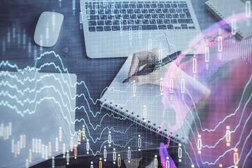 Forex chart displayed on woman's hand taking notes background. Concept of research. Multi exposure