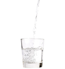 Pour water into a glass isolated with clipping path included.
