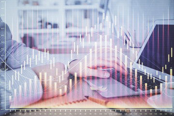 Multi exposure of stock market chart with man working on computer on background. Concept of financial analysis.