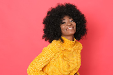 Such a positive person! Lovely african model with big smile in yellow sweater. - obrazy, fototapety, plakaty
