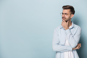 Close up portrait with pensive handsome bearded man.