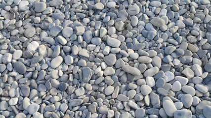 Nature background from gray sea pebbles