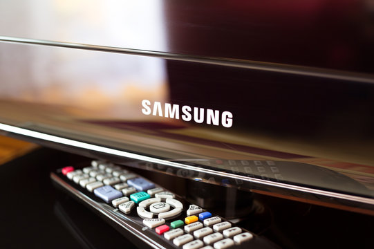 HAVIROV, CZECH REPUBLIC - MAY 2, 2016: Modern black television and remote control. Samsung is South Korean multinational conglomerate company. One group of company is focused on electronics industry