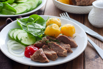 The option of serving baked turkey meat with vegetables for dinner, selective focus