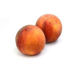 Ripe peach fruits isolated on white background.