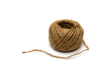 Single skein of natural jute on a white background. Concept of eco-friendly materials. Closeup