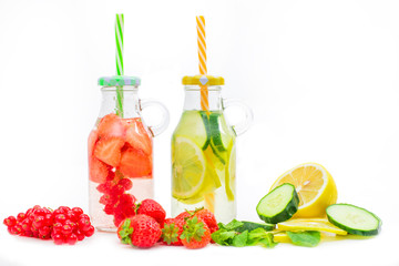 Fototapeta na wymiar Health care, fitness, healthy nutrition diet concept. Fresh cool strawberry and lemon and mint infused water, detox drink, in a glass jar.