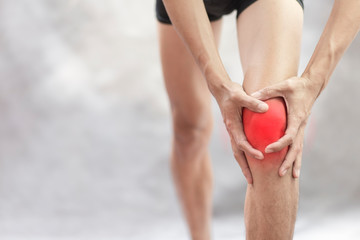 Hand of man catch the  knee pain during exercises