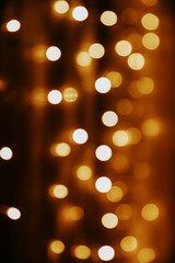 Abstract golden background. Festive bokeh lights background.