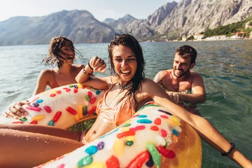 Foto op Plexiglas Young trendy people having fun swimming in summer vacation © Mediteraneo