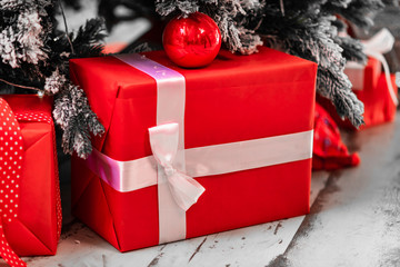  Big red gift box under the christmas tree. Christmas presents
