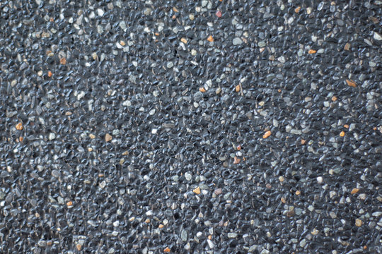 The polished stone walls are mixed with black and white small stones coated with wax. As a background and arrangement pattern of stone beads