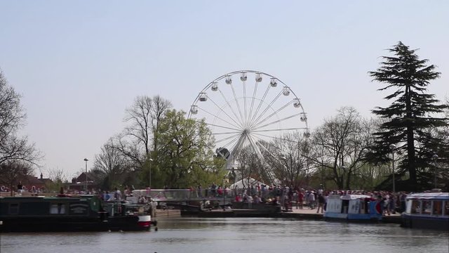 Stratford upon Avon Canal narrow boat mooring with big wheel in background
