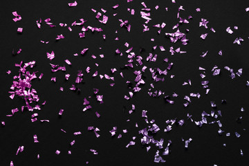 pink purple gradient confetti on a black background - festive Christmas / New Year backdrop